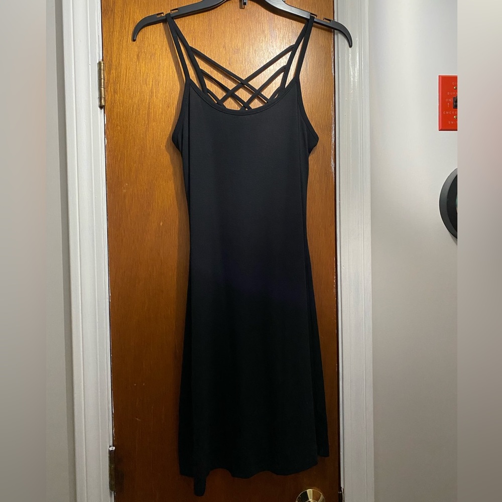 Stretchy black dress with strap detailing on the back